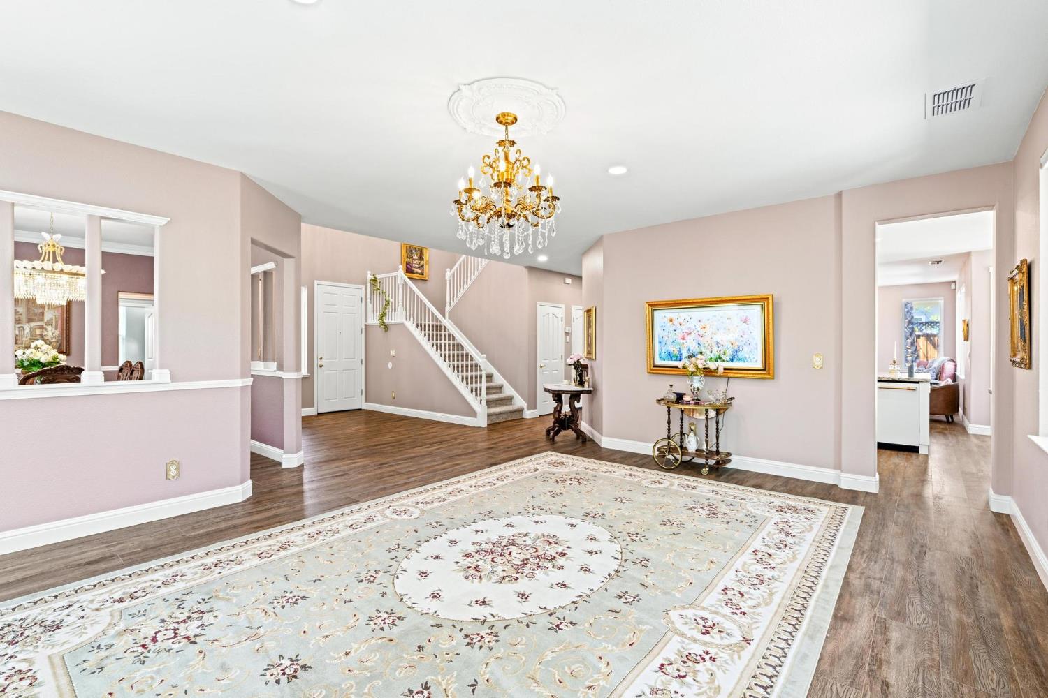 426 South Highland Avenue Ripon, CA 95366 - Photo 15 of 82 a view of a livingroom with wooden floor and a hallway