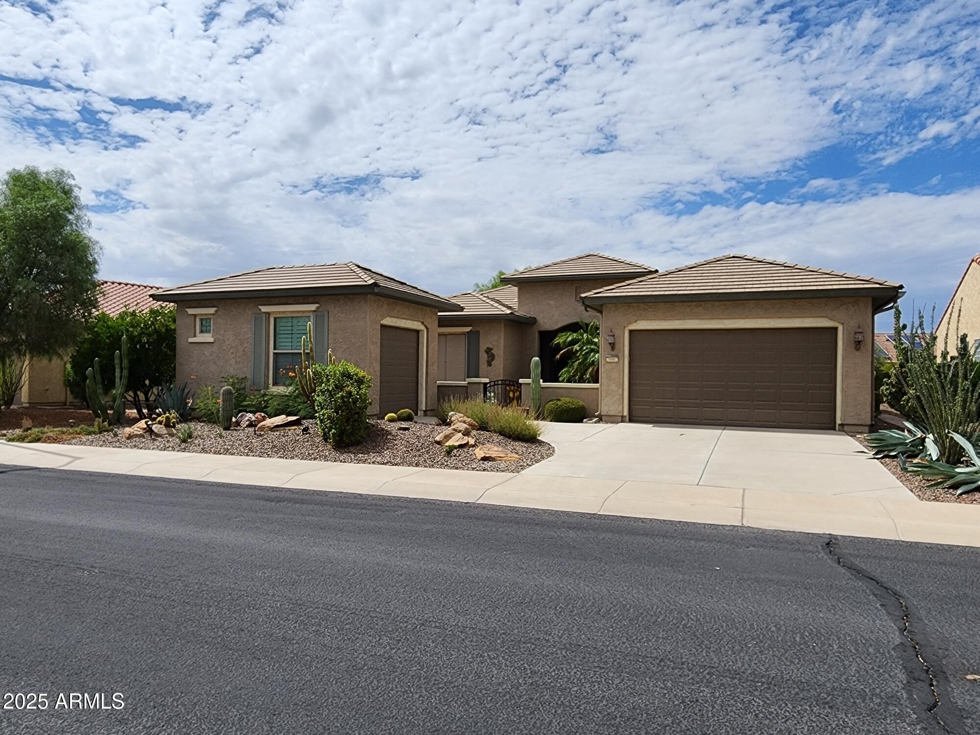 a view of a house with outdoor space and a car parked in front of it