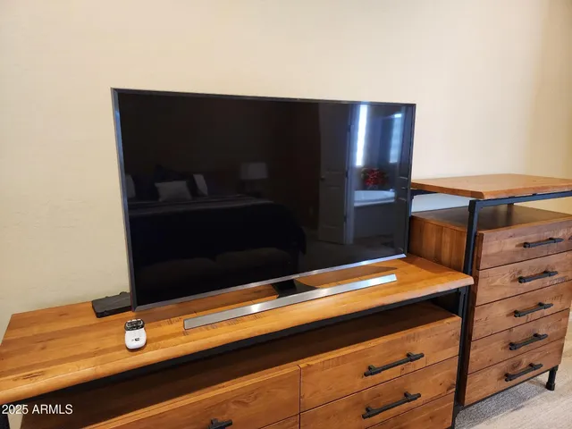 a spacious bathroom with a double vanity sink and a mirror
