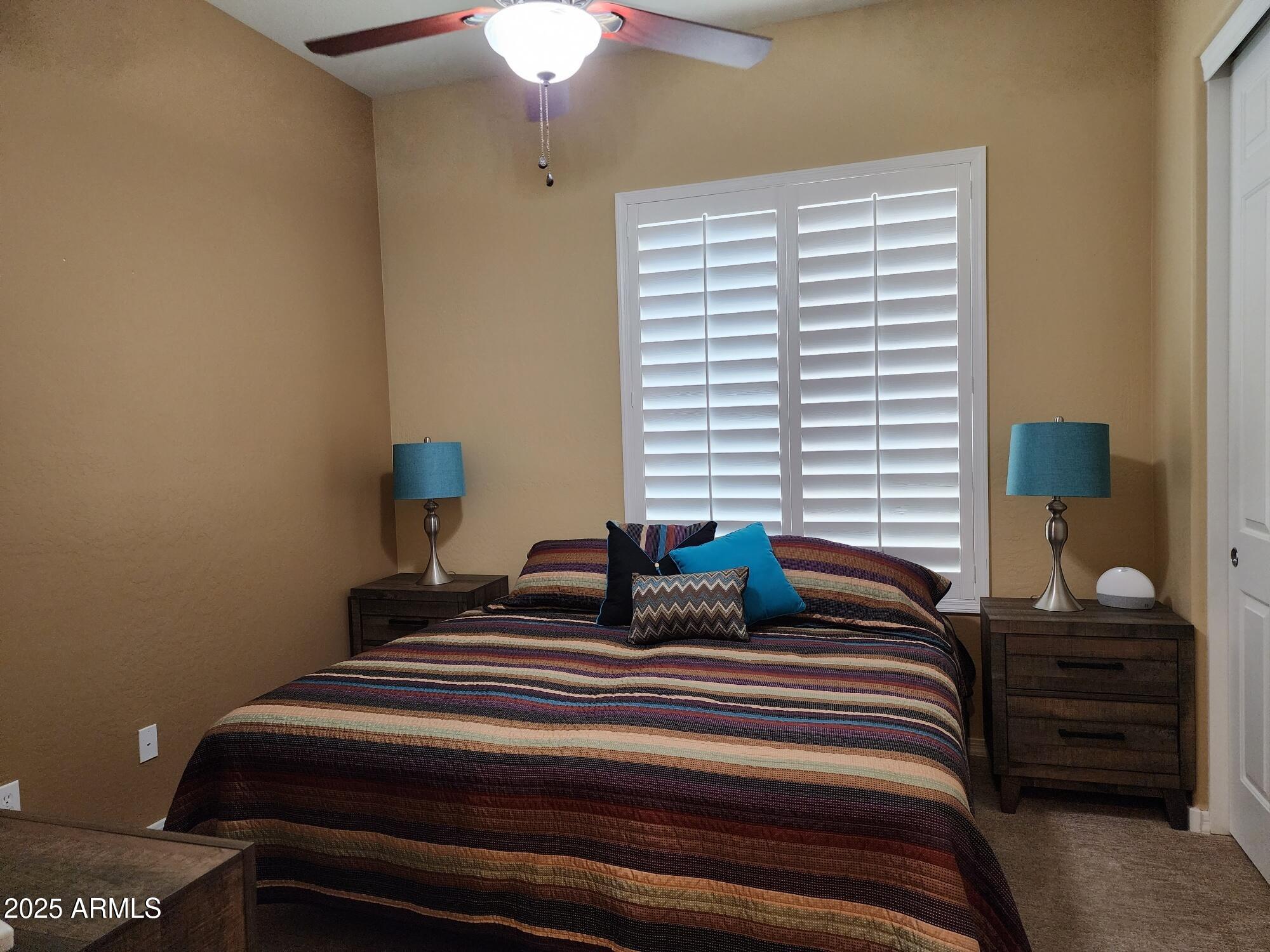 20002 North 269th Drive Buckeye, AZ 85396 - Photo 15 of 29 a bedroom with bed and a window