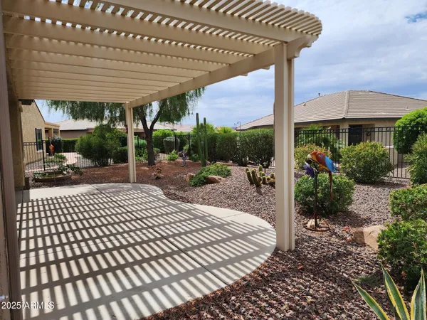 a view of a patio with a table and chairs
