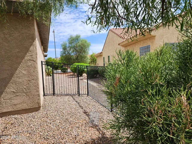 a balcony view with a glass door