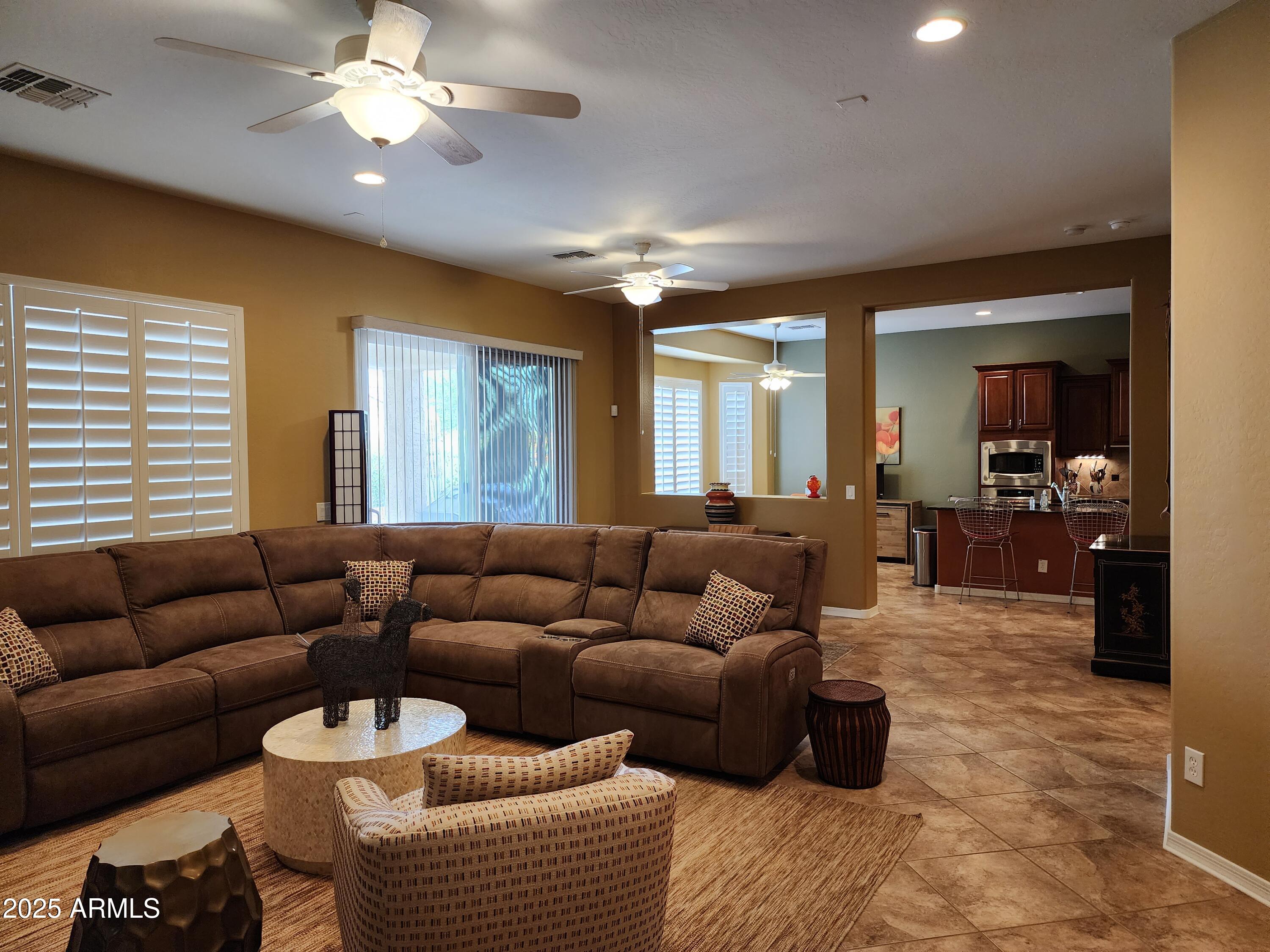 20002 North 269th Drive Buckeye, AZ 85396 - Photo 4 of 29 a living room with furniture and a large window