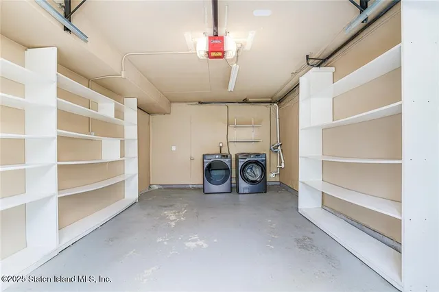 a view of a storage & utility room with washer and dryer