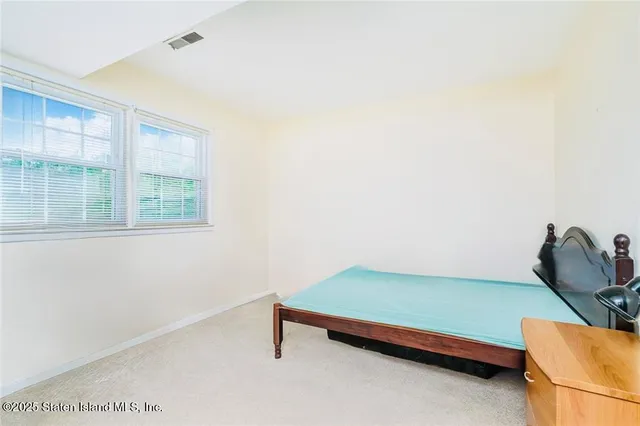 a view of a room with furniture and window