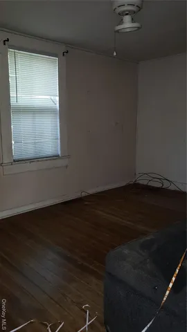 a view of wooden floor in an empty room