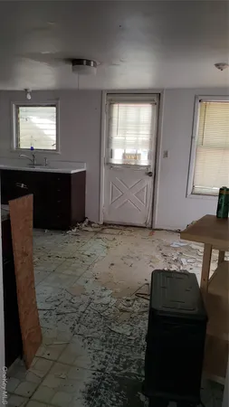 a view of a livingroom with furniture and window