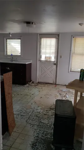 a view of a livingroom with furniture and window