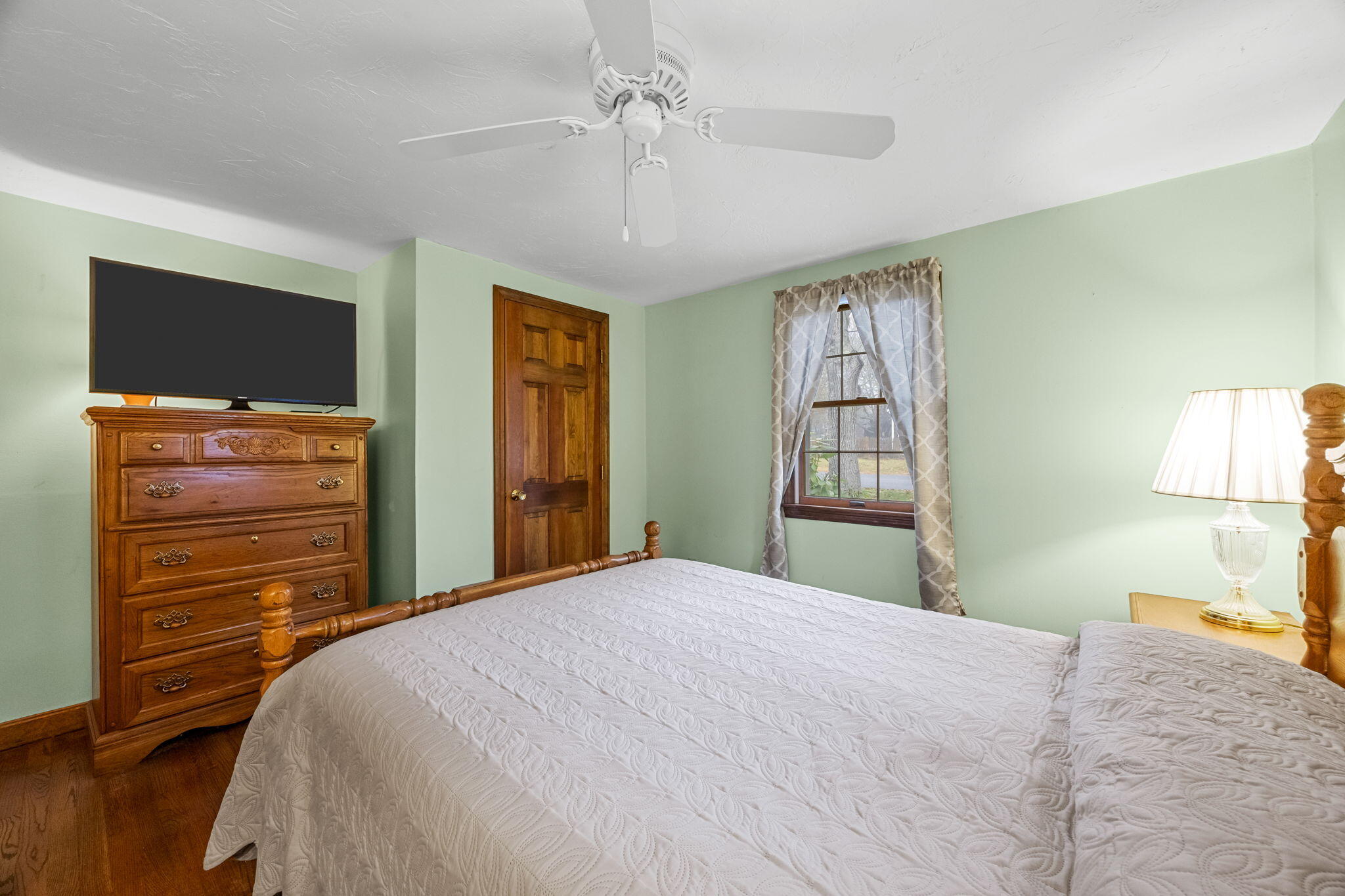 21 Princes Street Harwich, MA 02645 - Photo 19 of 30 a bedroom with a bed and a dresser