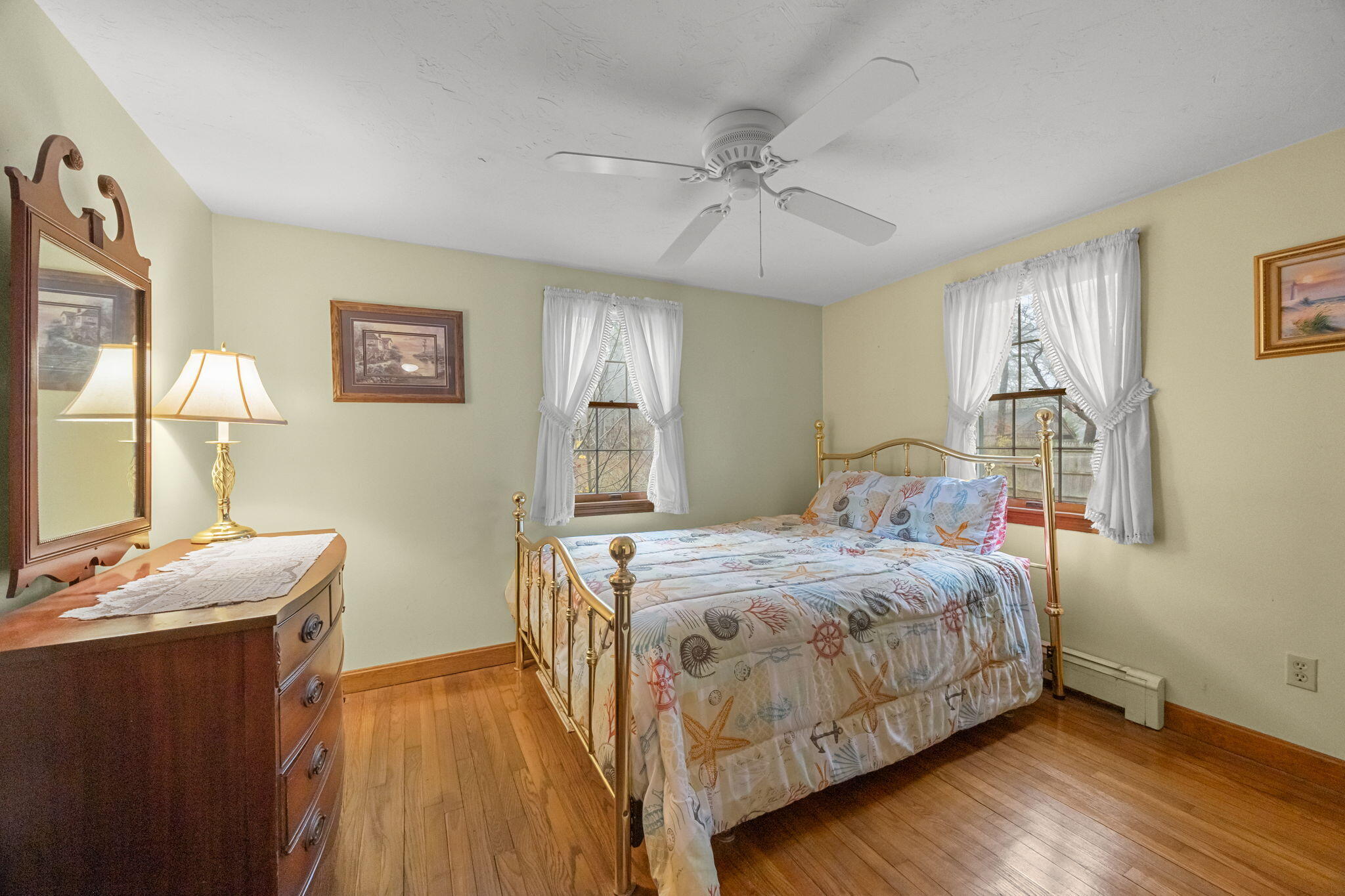 21 Princes Street Harwich, MA 02645 - Photo 20 of 30 a bedroom with a bed and wooden floor