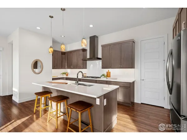 a kitchen with a counter space a sink and cabinets