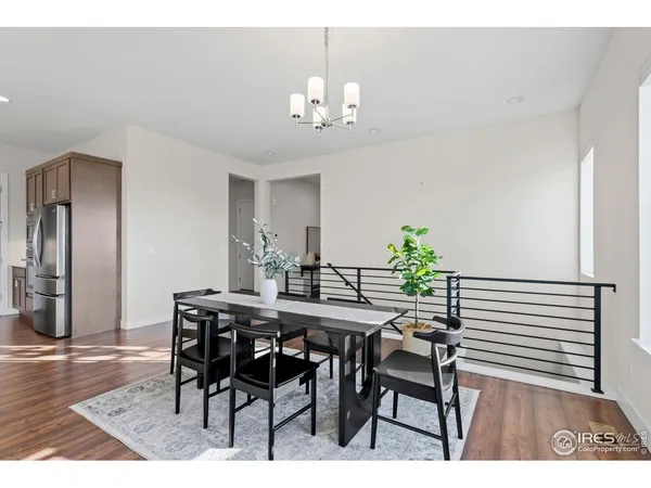 a kitchen with a sink and a refrigerator