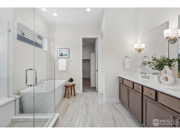 a bedroom with a bed and a lamp