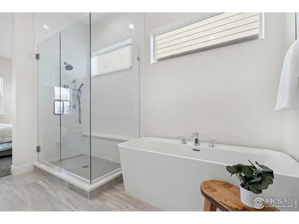 a hallway with a sink and wooden floor
