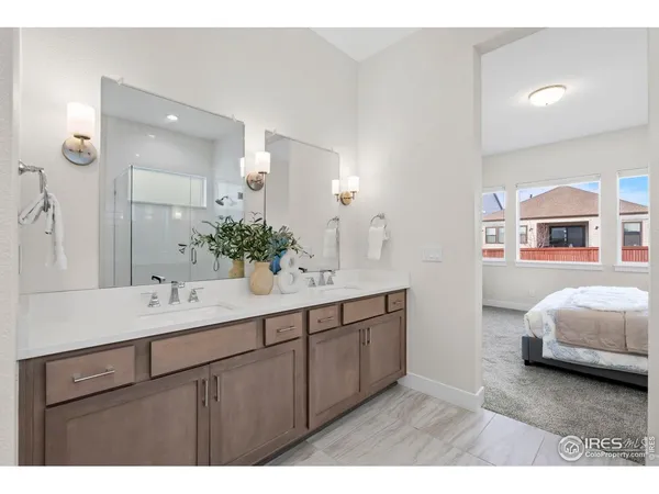 a bathroom with a shower and a sink