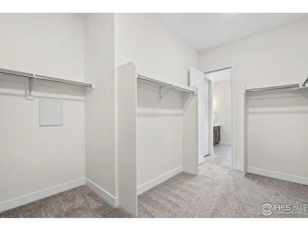 a en suite bathroom with a double vanity sink and a mirror
