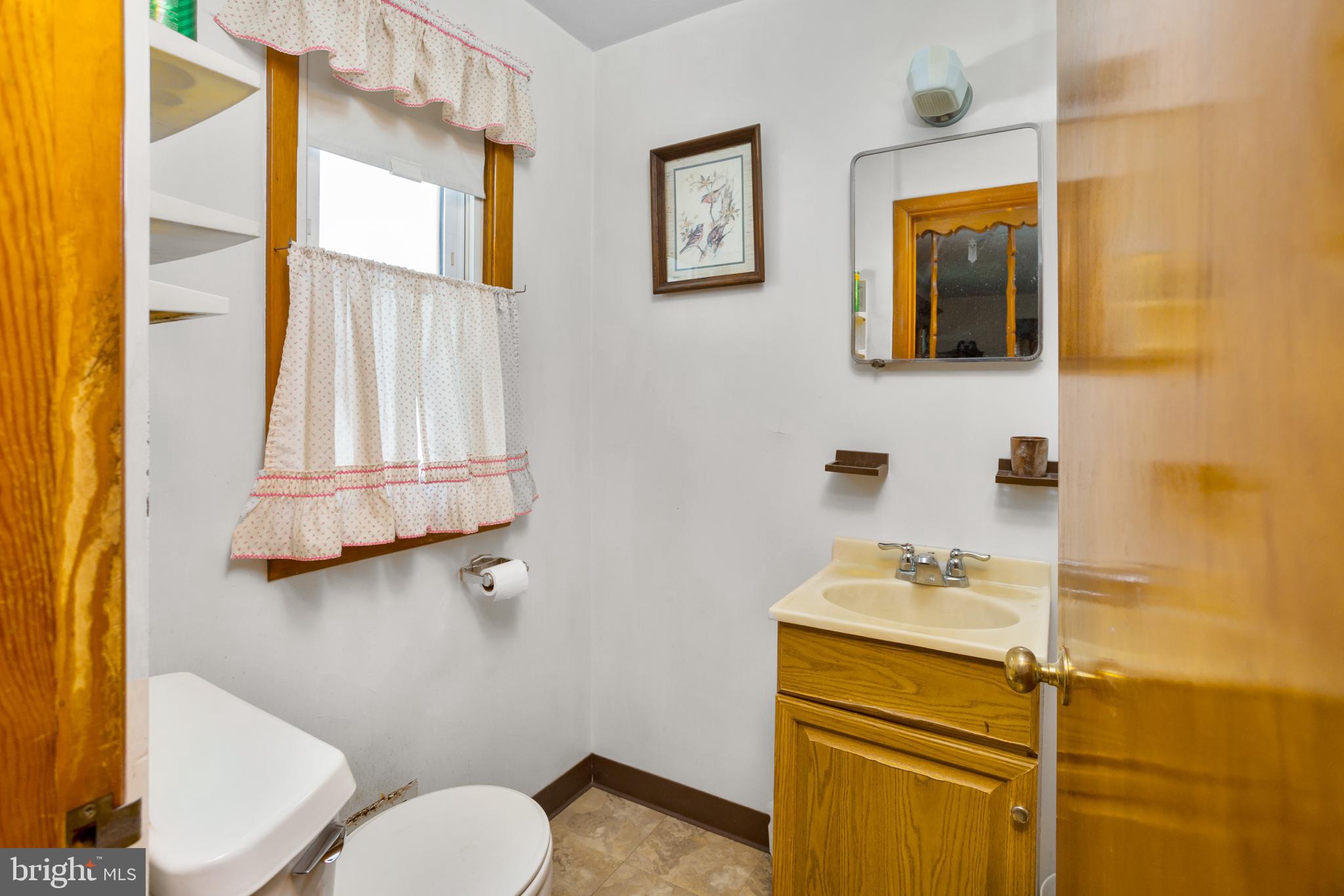 32 Hartman Drive Hamilton, NJ 08690 - Photo 16 of 23 a bathroom with a sink mirror and toilet