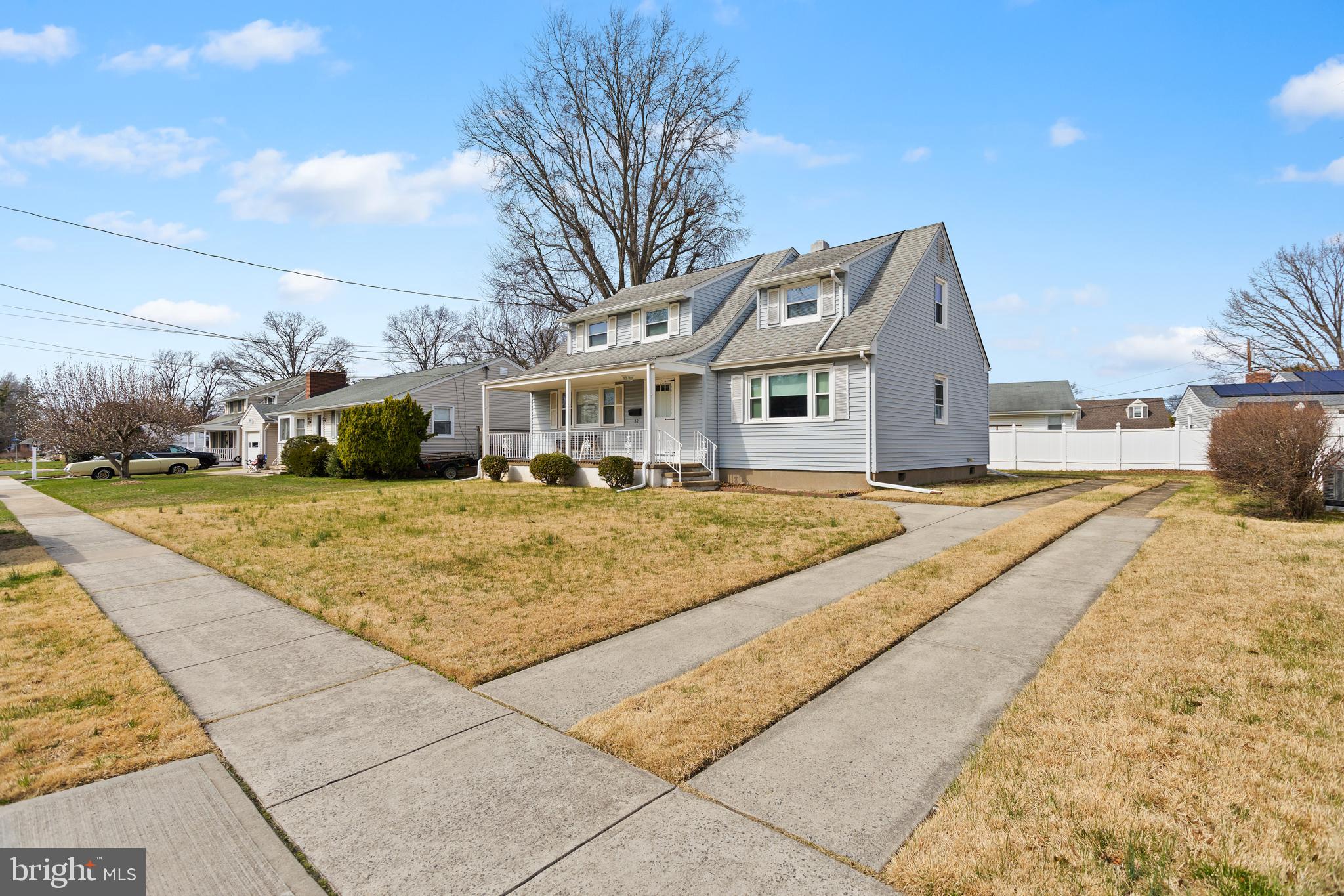 32 Hartman Drive Hamilton, NJ 08690 - Photo 3 of 23 a front view of a house with a yard