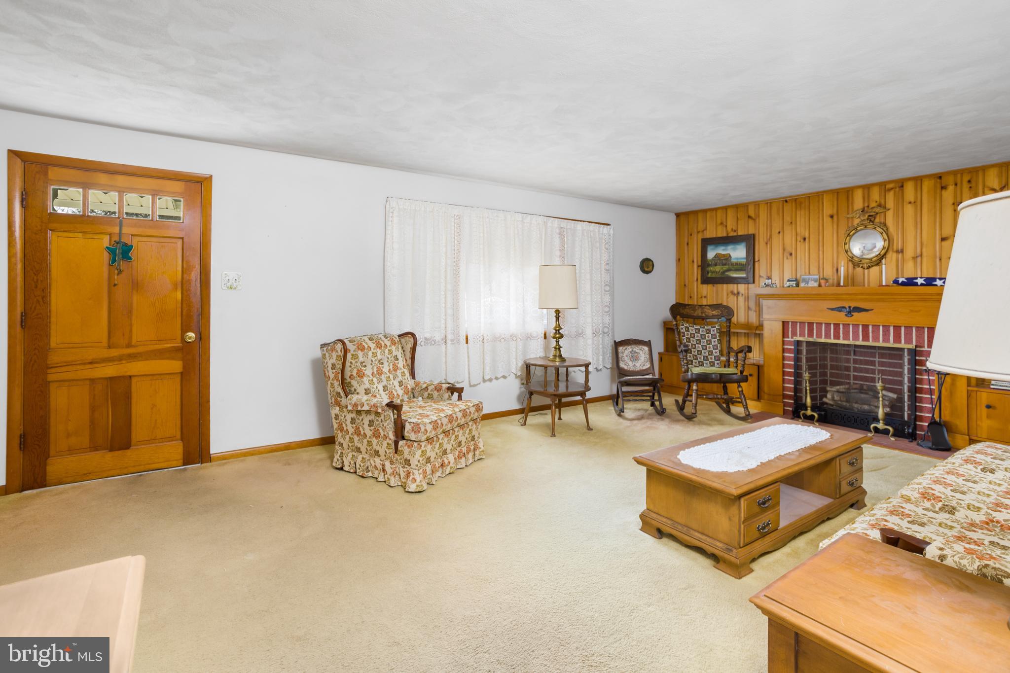 32 Hartman Drive Hamilton, NJ 08690 - Photo 7 of 23 a living room with furniture and a floor to ceiling window