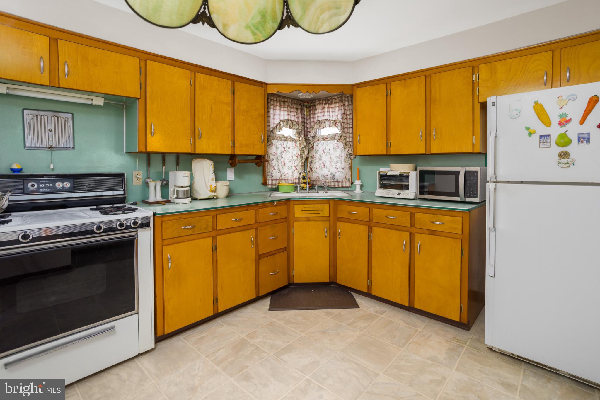 32 Hartman Drive Hamilton, NJ 08690 - Photo 9 of 23 a kitchen with stainless steel appliances granite countertop a sink and cabinets