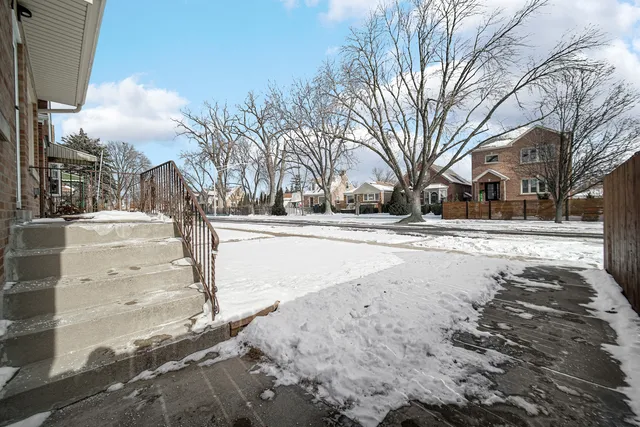 a view of road yard and trees
