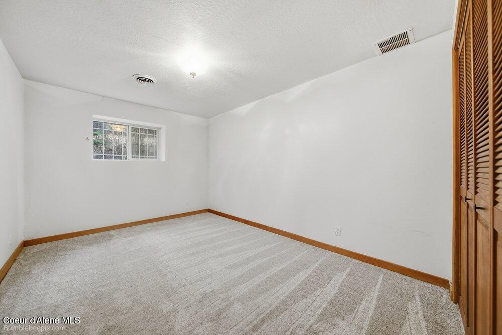 7722 West Clemetson Road Coeur D'Alene, ID 83814 - Photo 39 of 53 Basement Bedroom