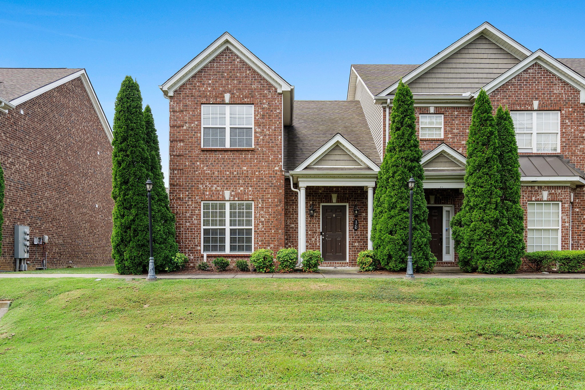 316 Rowlette Circle Murfreesboro, TN 37127 - Photo 1 of 25 a front view of a house with a yard and trees