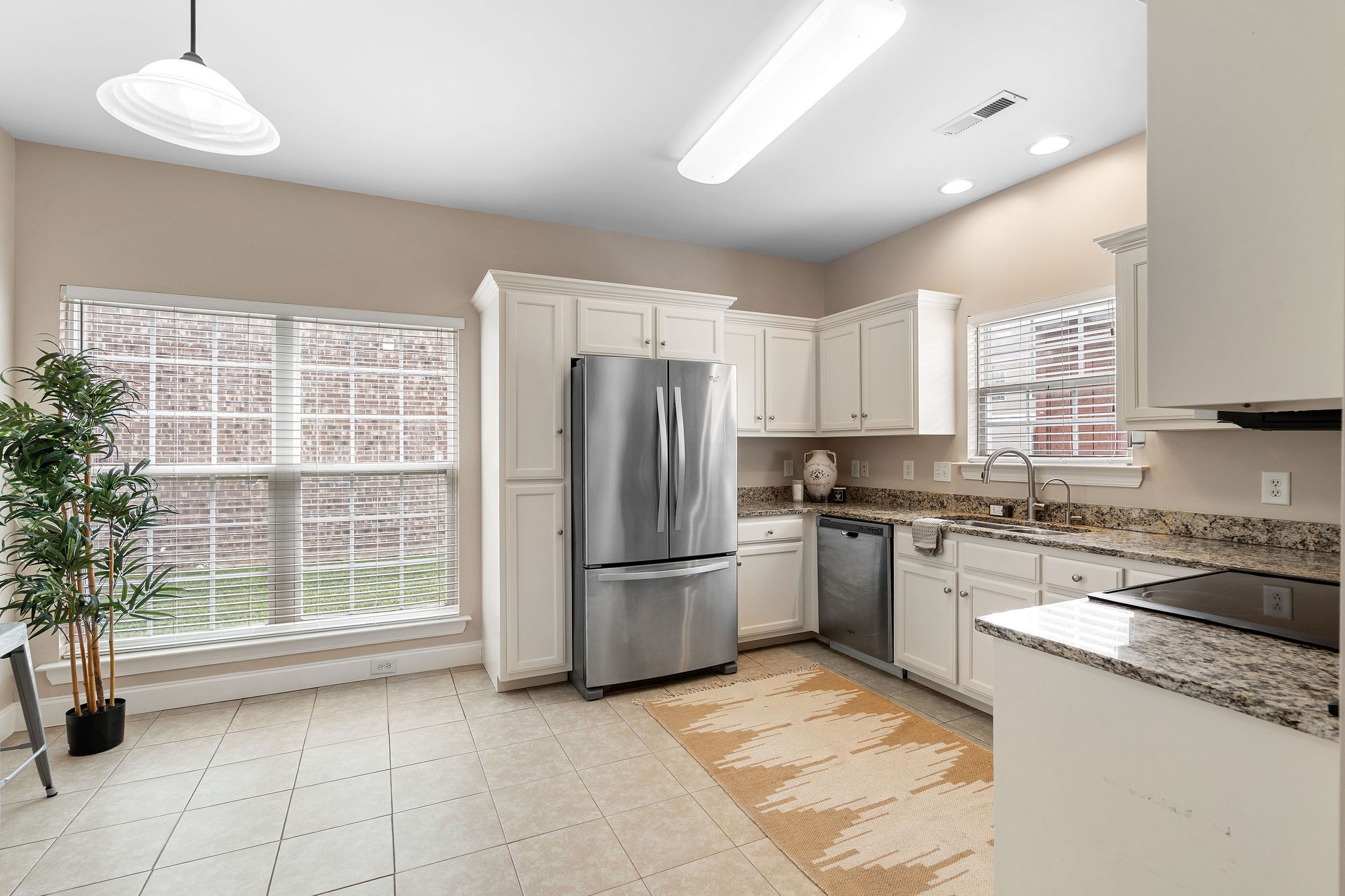 316 Rowlette Circle Murfreesboro, TN 37127 - Photo 6 of 25 a kitchen with a sink a refrigerator and cabinets