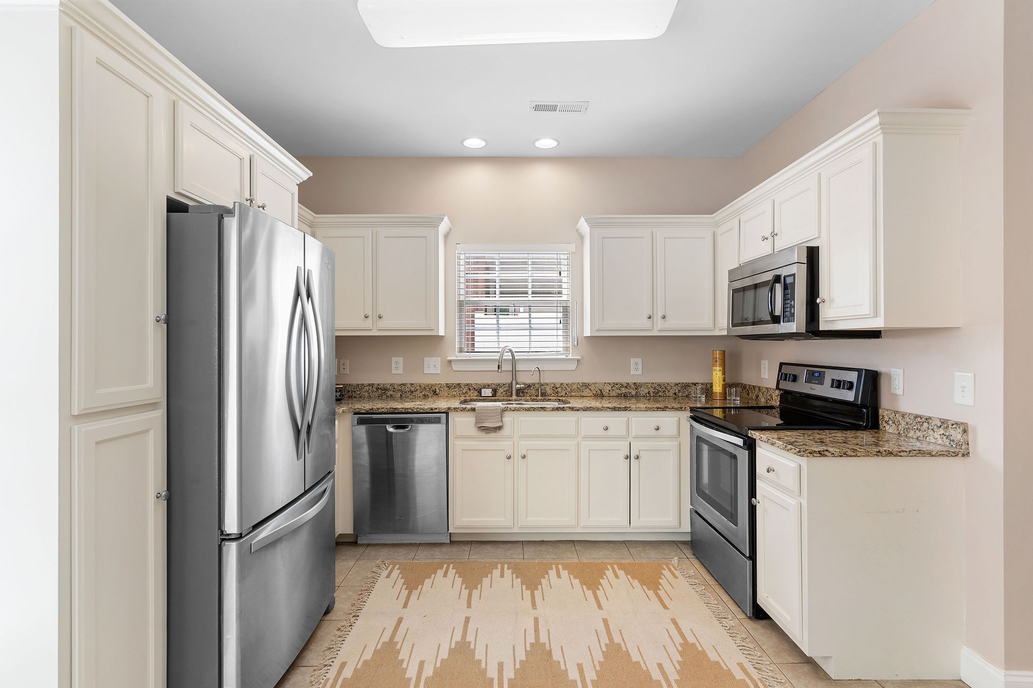 316 Rowlette Circle Murfreesboro, TN 37127 - Photo 7 of 25 a kitchen with stainless steel appliances granite countertop a refrigerator stove microwave and sink