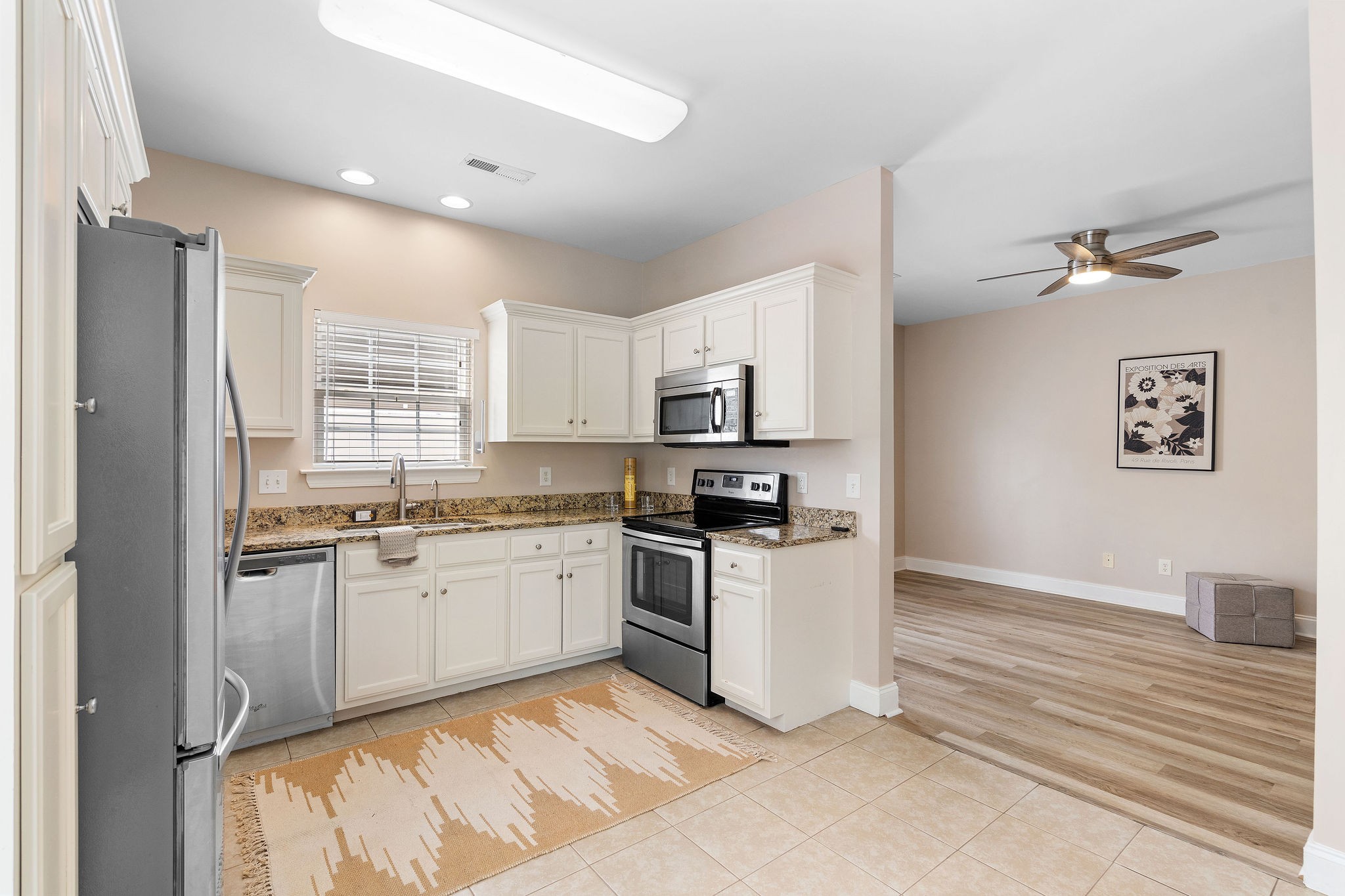316 Rowlette Circle Murfreesboro, TN 37127 - Photo 8 of 25 a kitchen with stainless steel appliances granite countertop a stove top oven a sink and a refrigerator