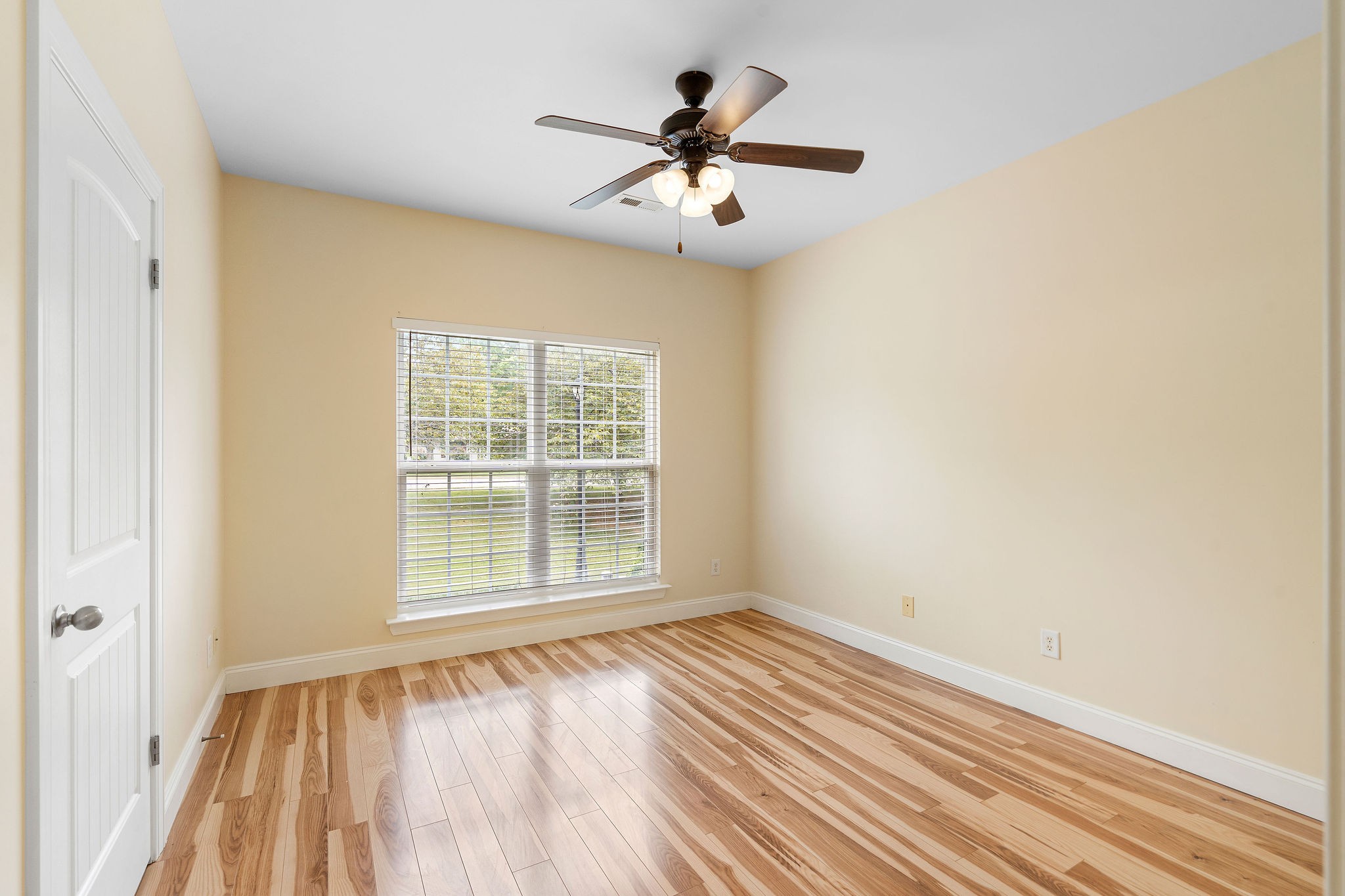 316 Rowlette Circle Murfreesboro, TN 37127 - Photo 10 of 25 a view of an empty room with wooden floor and a window