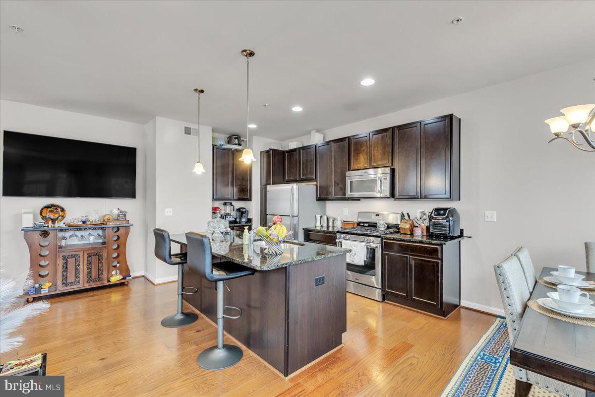 49 Steeplechase Drive La Plata, MD 20646 - Photo 13 of 27 a kitchen with microwave a stove and furniture