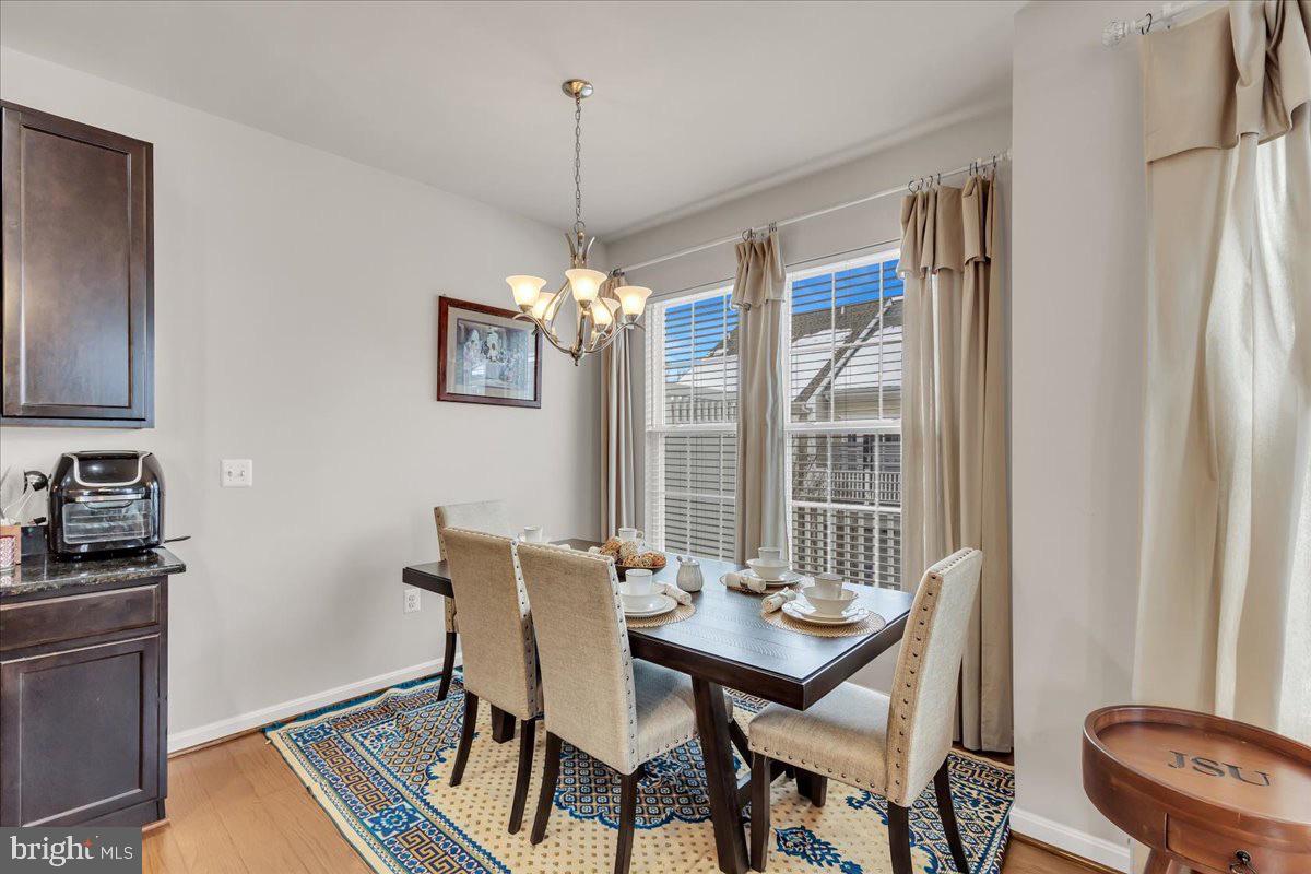 49 Steeplechase Drive La Plata, MD 20646 - Photo 14 of 27 a view of a dining room with furniture window and wooden floor