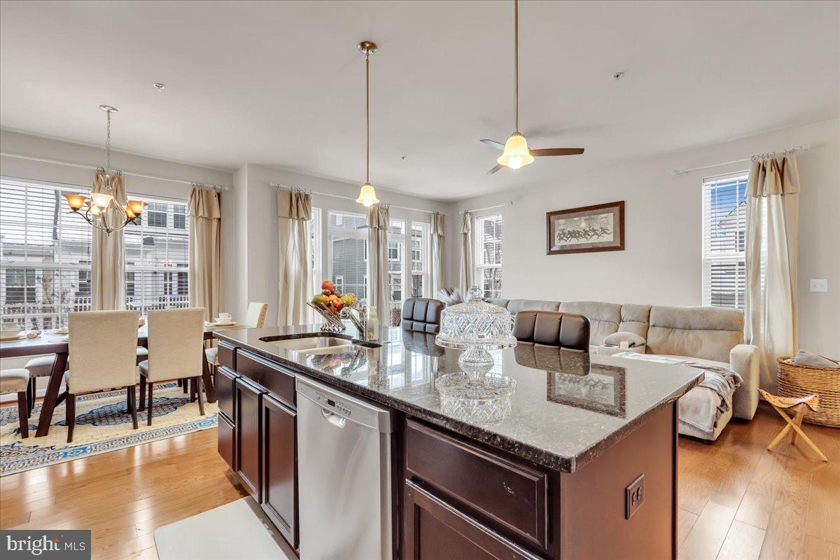49 Steeplechase Drive La Plata, MD 20646 - Photo 18 of 27 a living room with furniture a dining table and a chandelier