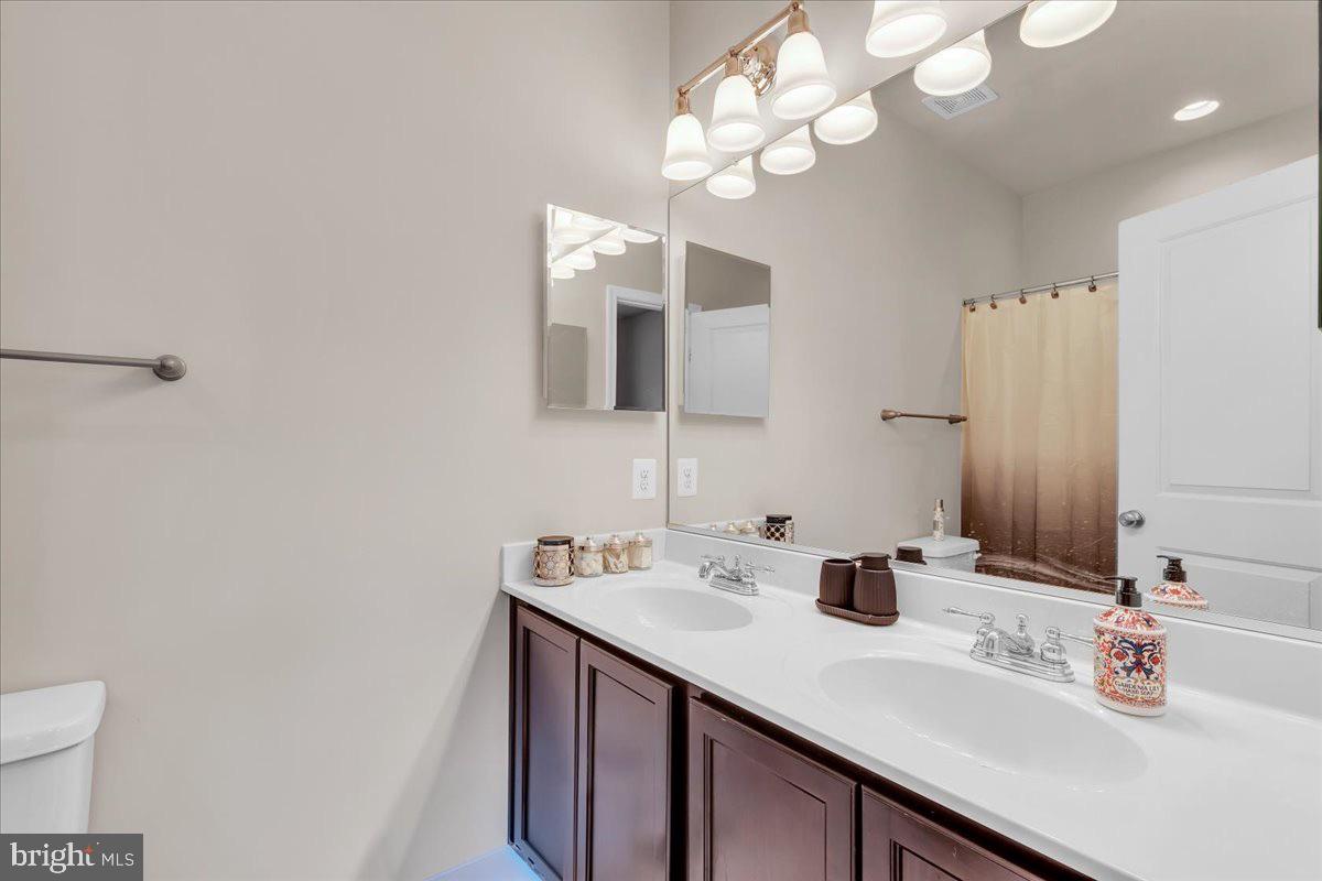 49 Steeplechase Drive La Plata, MD 20646 - Photo 22 of 27 a bathroom with a sink vanity and a mirror