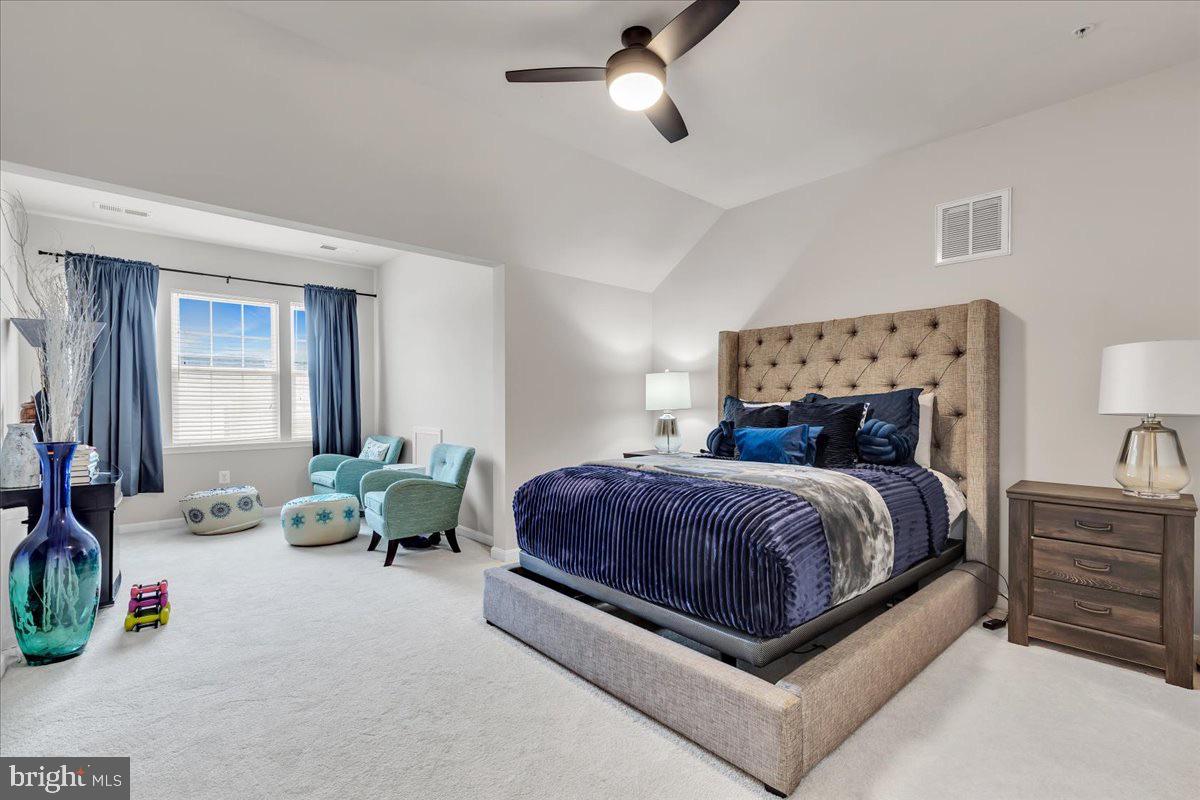 49 Steeplechase Drive La Plata, MD 20646 - Photo 23 of 27 a spacious bedroom with a bed and a couch