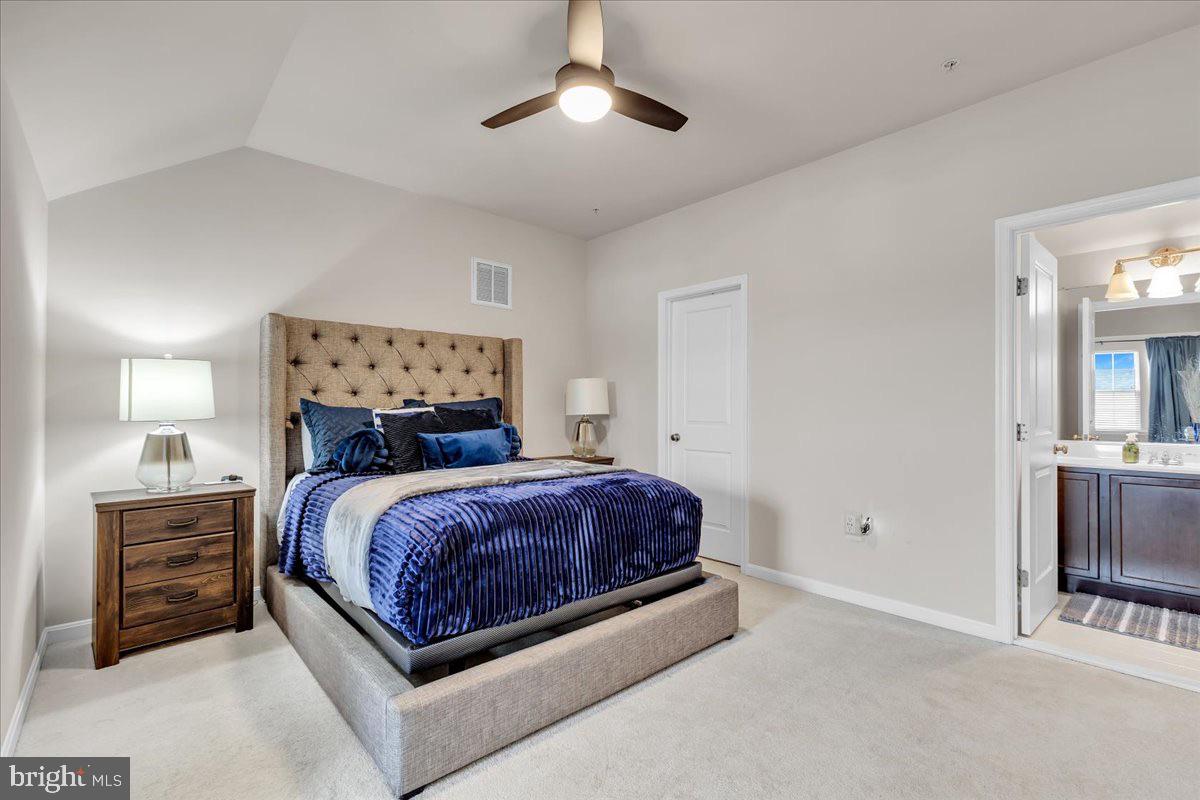 49 Steeplechase Drive La Plata, MD 20646 - Photo 24 of 27 a bed sitting in a bedroom and chandelier