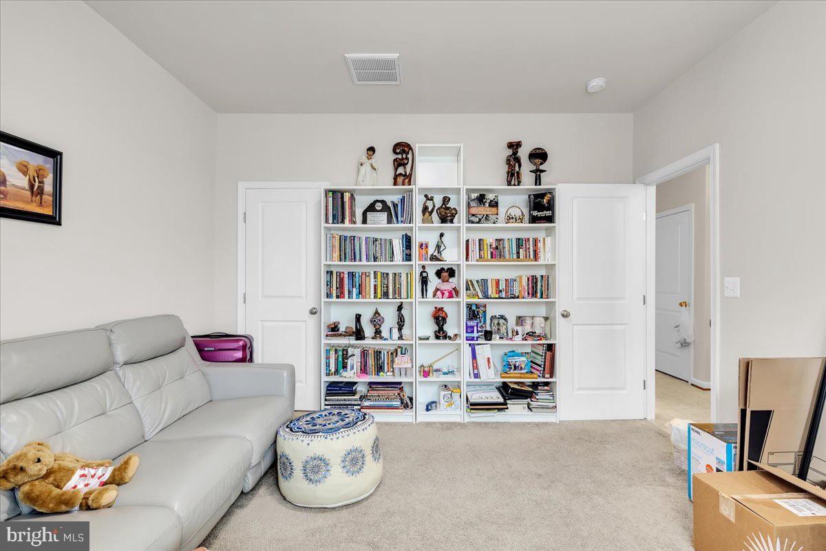49 Steeplechase Drive La Plata, MD 20646 - Photo 6 of 27 a living room with furniture and a book shelf