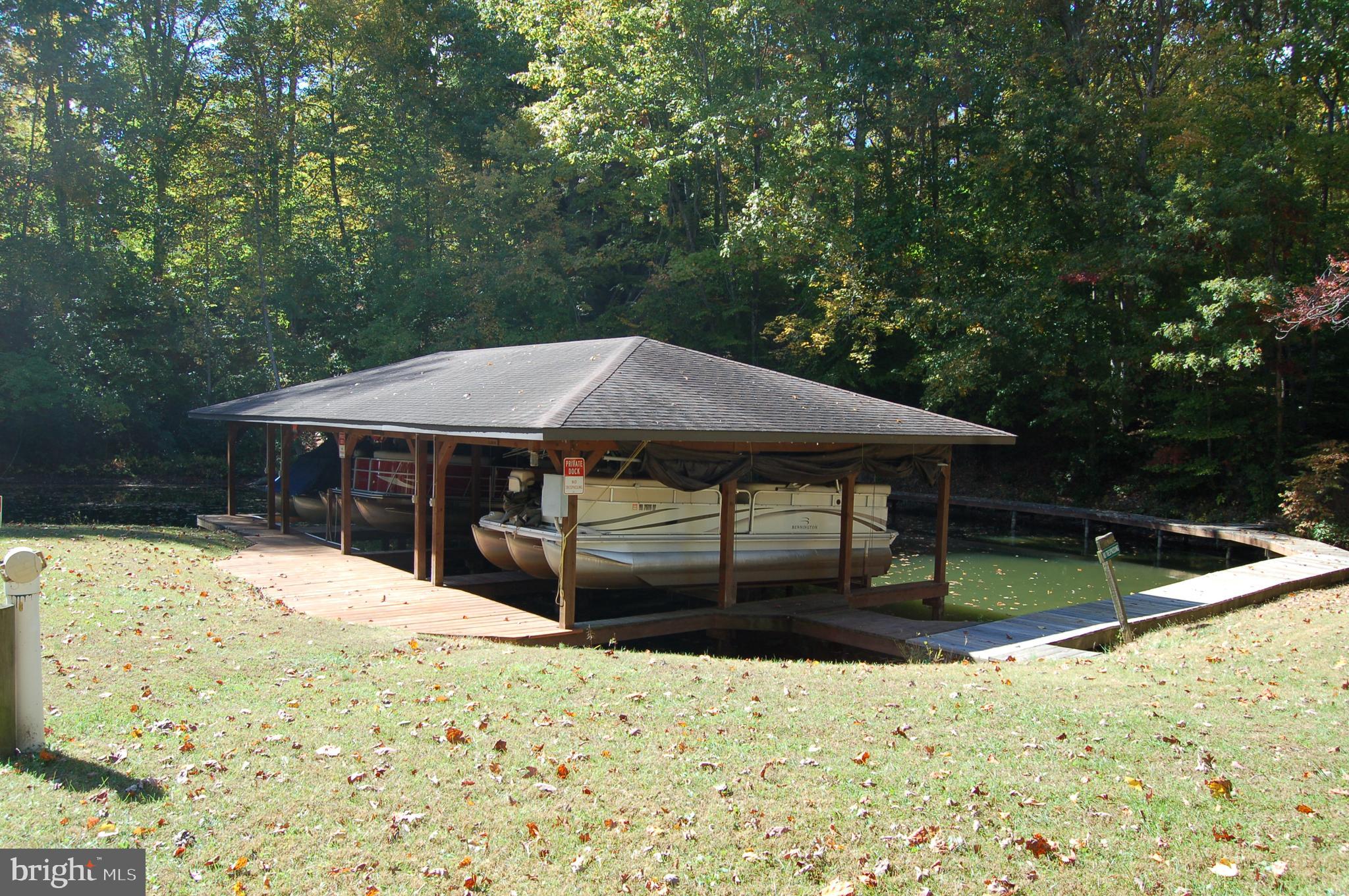 5400 Spinnaker Way Mineral, VA 23117 - Photo 10 of 11 a backyard of a house with yard and trampoline