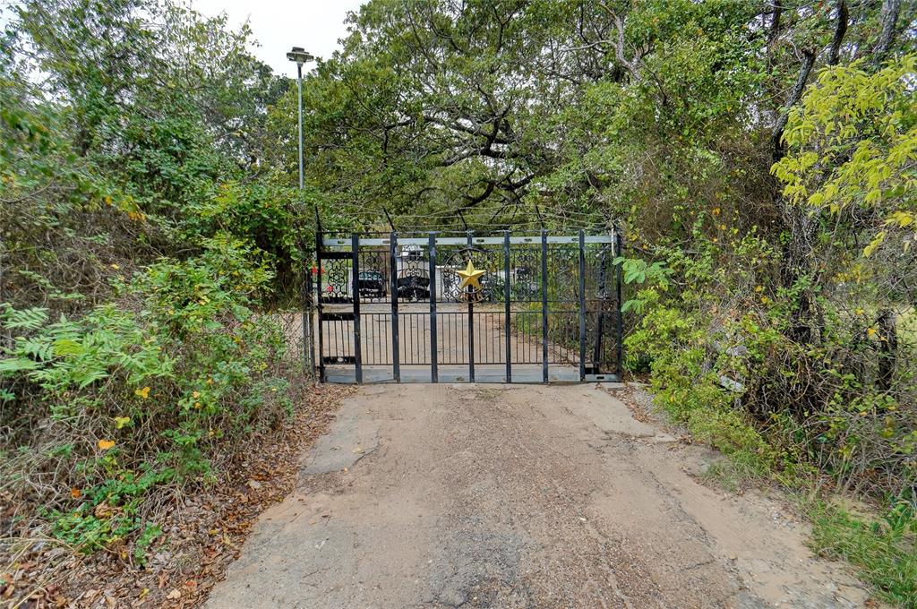 1000 Southeast Parkway Azle, TX 76020 - Photo 1 of 23 a view of a backyard with large trees