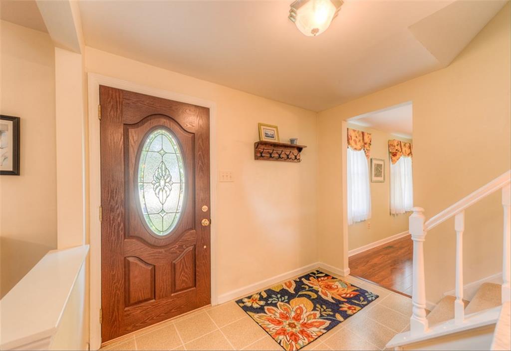 279 Shafer Road Coraopolis, PA 15108 - Photo 2 of 25 Great your guests in the large foyer open to both the dining and living rooms on either side.