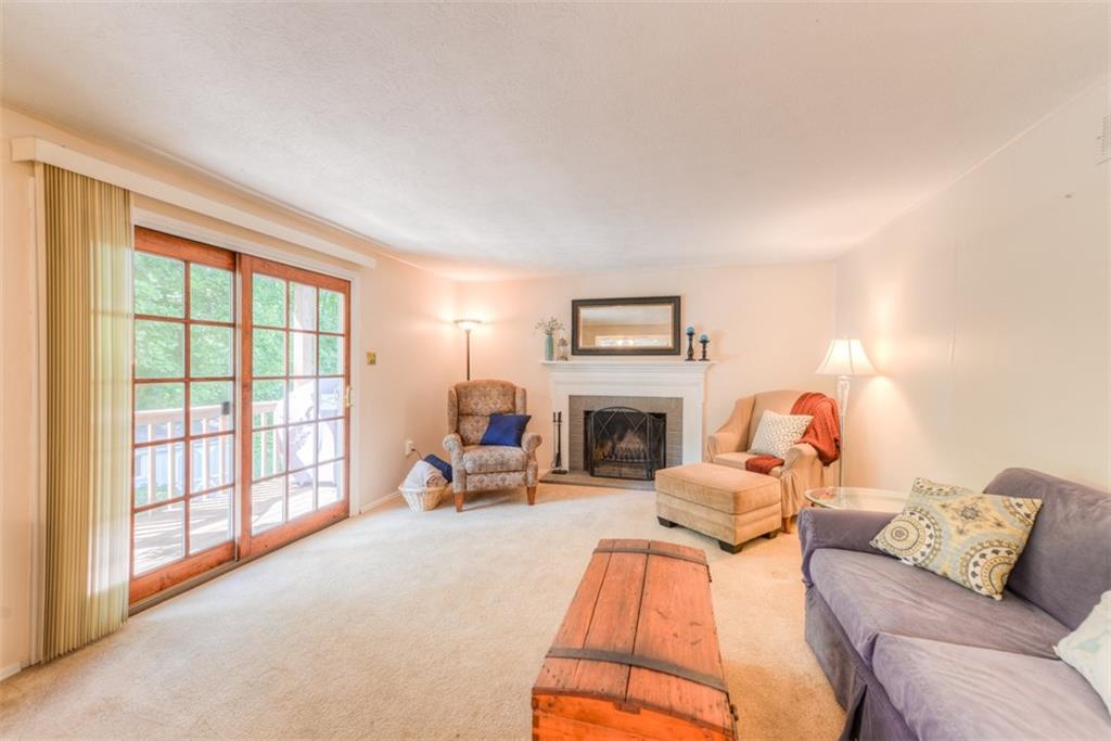 279 Shafer Road Coraopolis, PA 15108 - Photo 11 of 25 Curl up with a good book next to the wood burning fireplace, or enjoy watching your favorite movie in the comfort of this inviting family room.