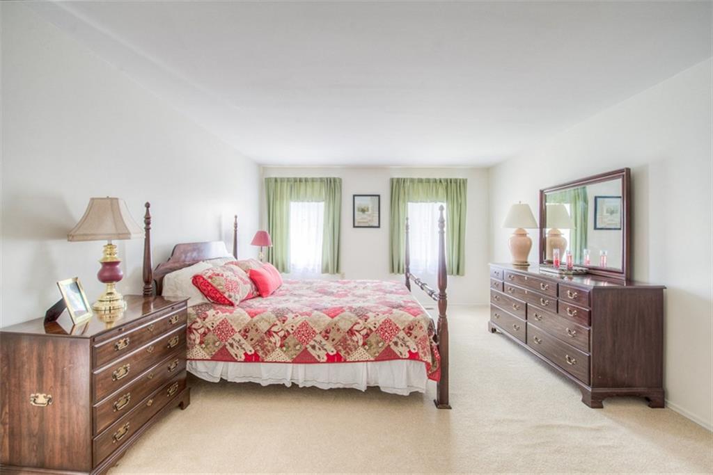 279 Shafer Road Coraopolis, PA 15108 - Photo 14 of 25 Natural light generously shines through the windows in your master bedroom which easily accommodates a complete set of bedroom furniture with room to spare.