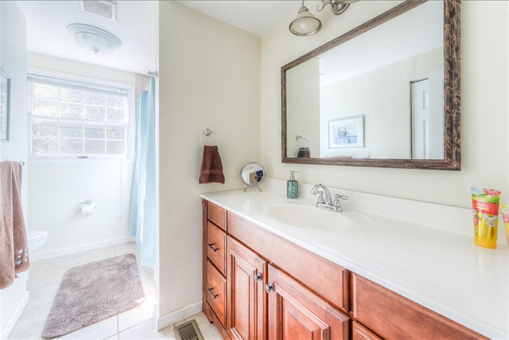 279 Shafer Road Coraopolis, PA 15108 - Photo 16 of 25 The main bathroom has a wide vanity with large countertop and plenty of storage.