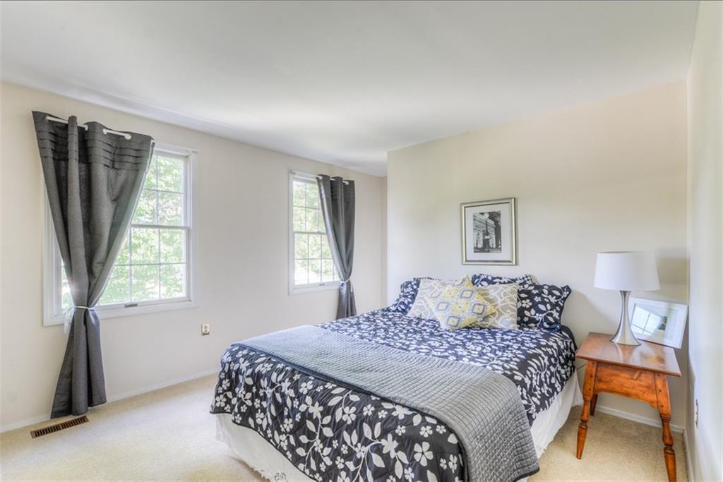 279 Shafer Road Coraopolis, PA 15108 - Photo 17 of 25 Natural light continues through the house in the second bedroom which easily accommodates a queen size bed.