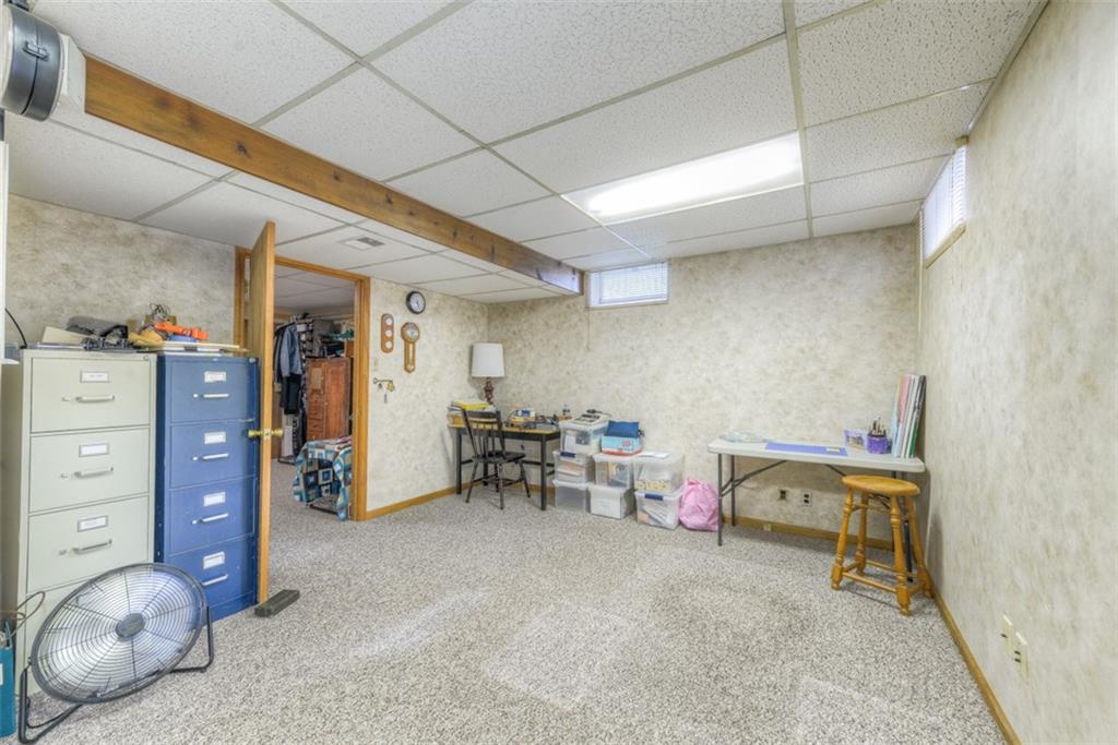 279 Shafer Road Coraopolis, PA 15108 - Photo 22 of 25 The second finished space in the basement is a walk-out and currently used as a craft space. It can easily function as a game or movie room.