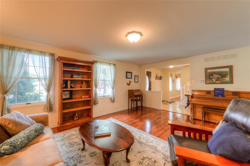 279 Shafer Road Coraopolis, PA 15108 - Photo 5 of 25 The formal living room easily accommodates large furniture and accent pieces to create a warm and comfortable place to welcome you home at night.