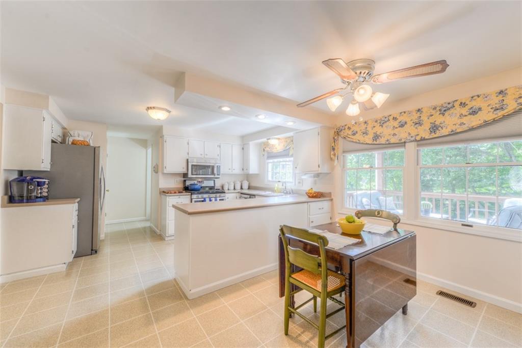 279 Shafer Road Coraopolis, PA 15108 - Photo 9 of 25 The breakfast nook in the kitchen overlooks the back deck and tree-lined yard. It is the perfect place to start the day with the family.