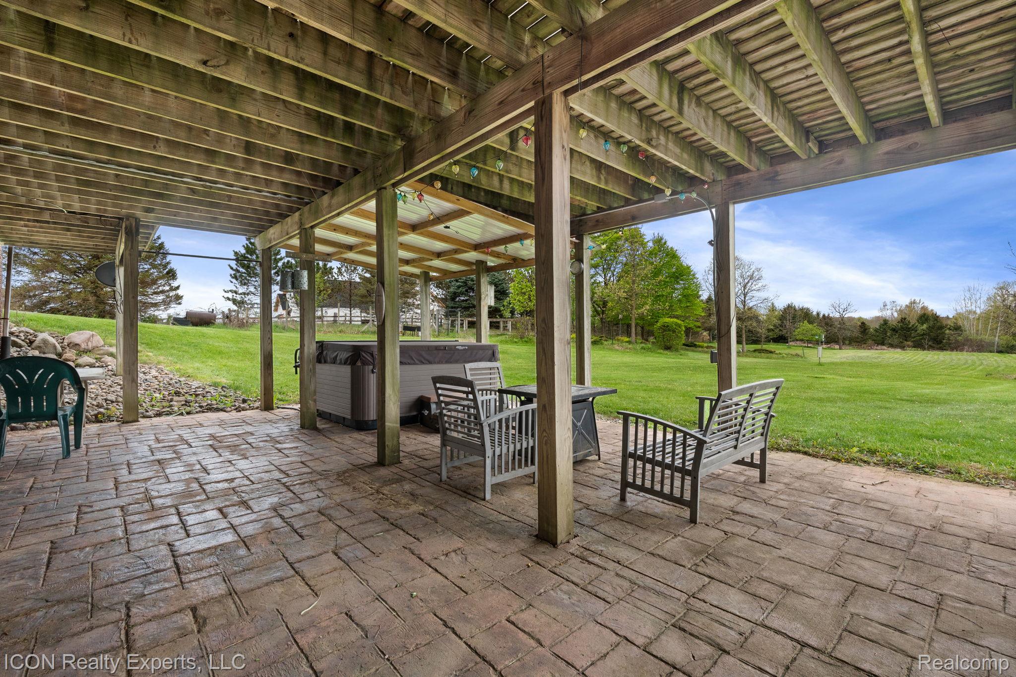 5128 Baldwin Road Metamora, MI 48455 - Photo 51 of 68 View of patio / terrace with a hot tub