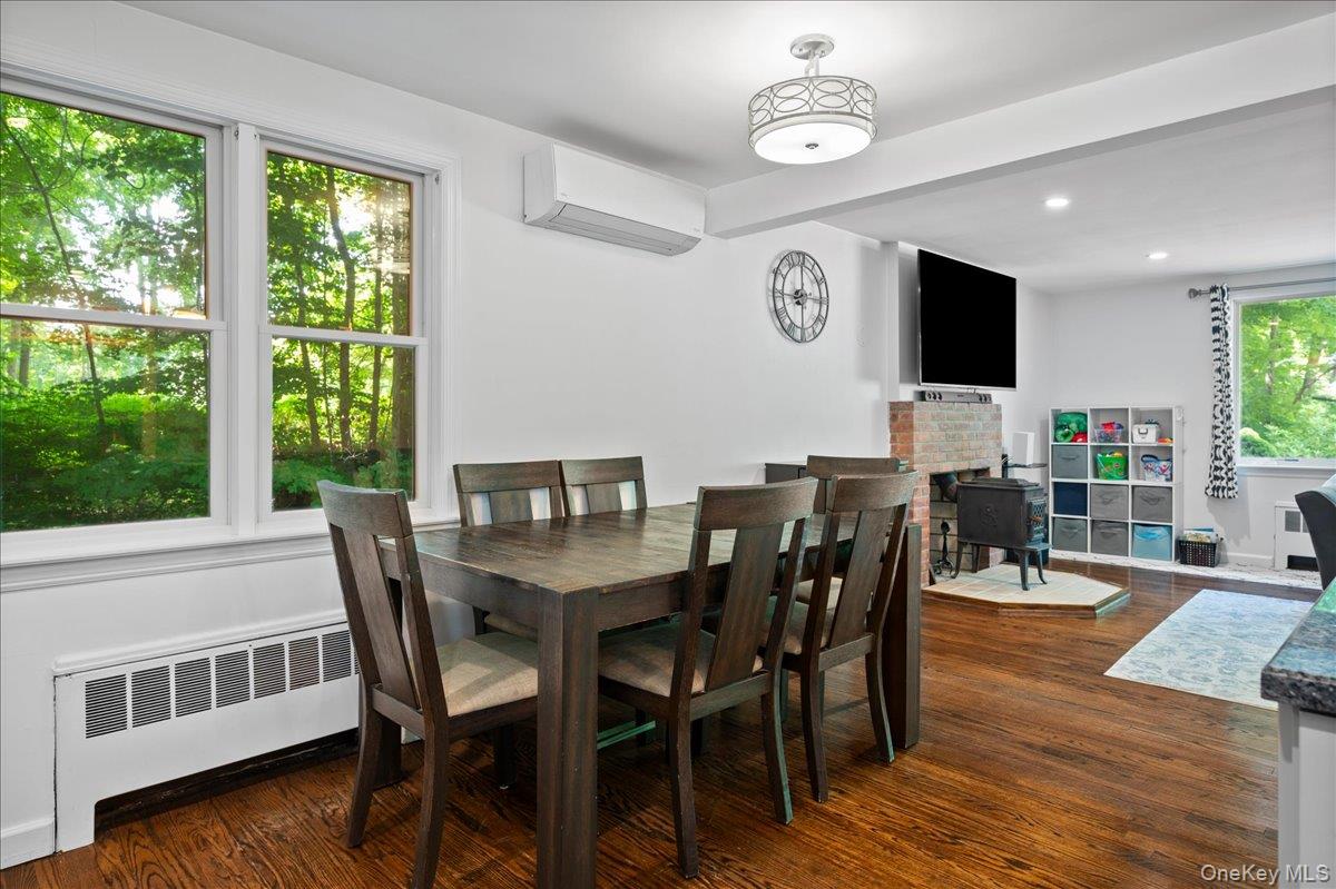 105 High St Extension Mount Kisco, NY 10549 - Photo 16 of 38 a view of a dining room with furniture window and wooden floor